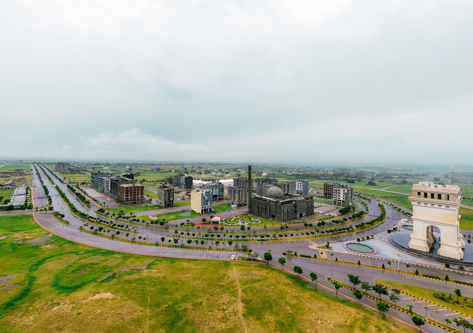 Aerial view of Faisal Hills Downtown with wide boulevards and commercial buildings