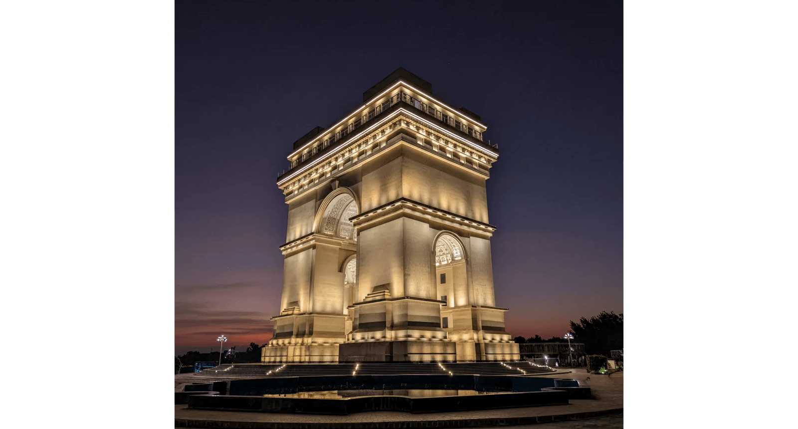 Faisal Hills Arc monument illuminated at night
